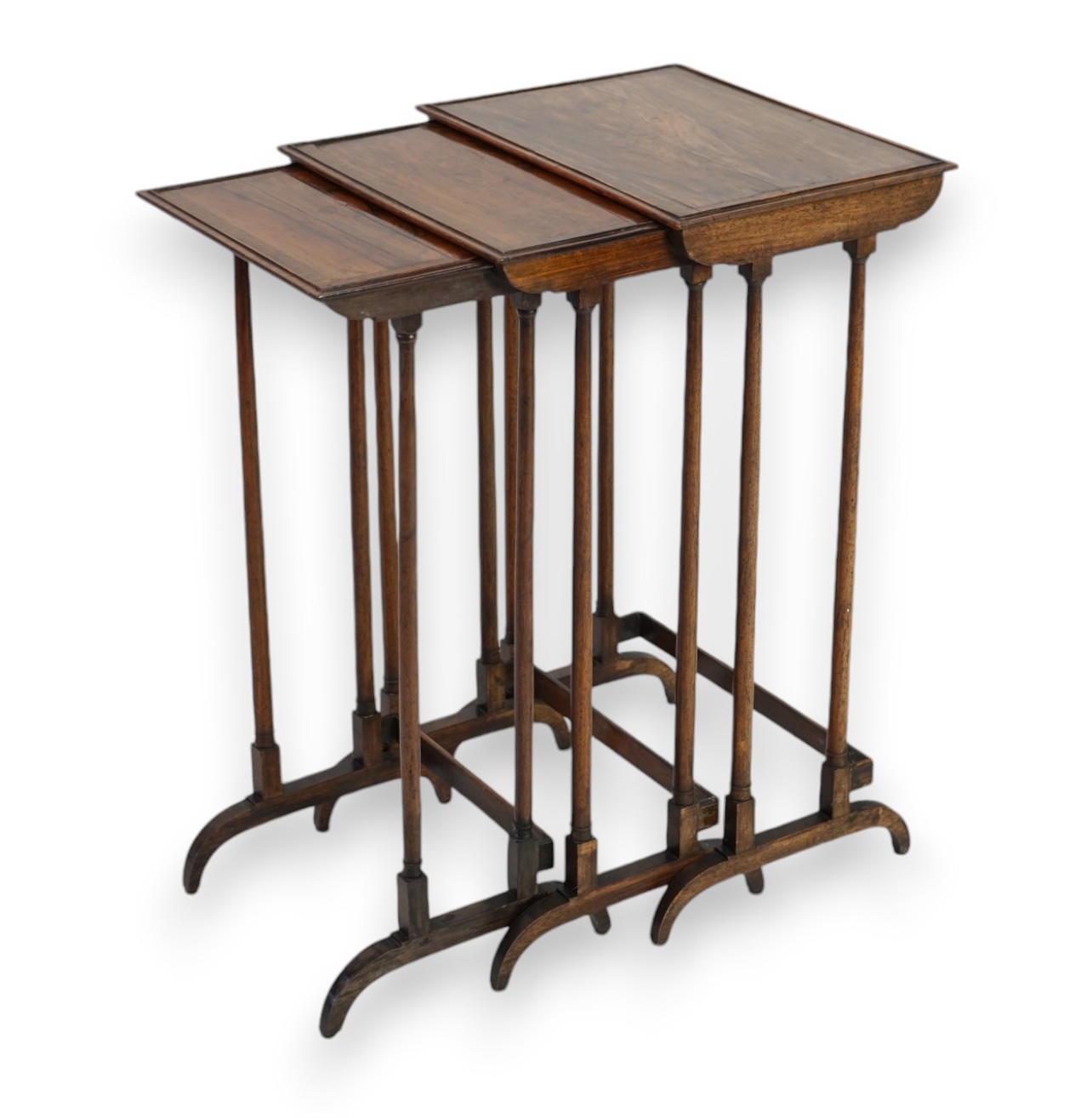 An Edwardian nest of three mahogany occasional tables